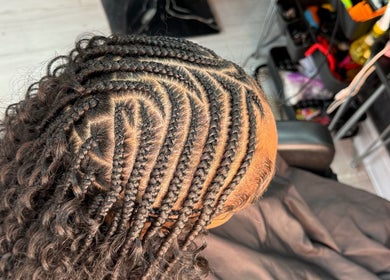 Intricate braiding style at Nancy’sBeauty salon in London, England, GB, showcasing expert hairstyling.