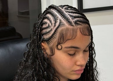 Intricate cornrow style at Nancy’sBeauty, London, England, GB salon showcasing stunning hair artistry.
