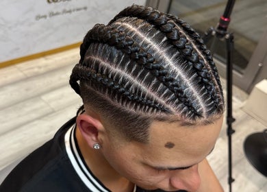 Detailed cornrow braids at Nancy’sBeauty, London, England, GB. Perfect for stylish hair transformation.