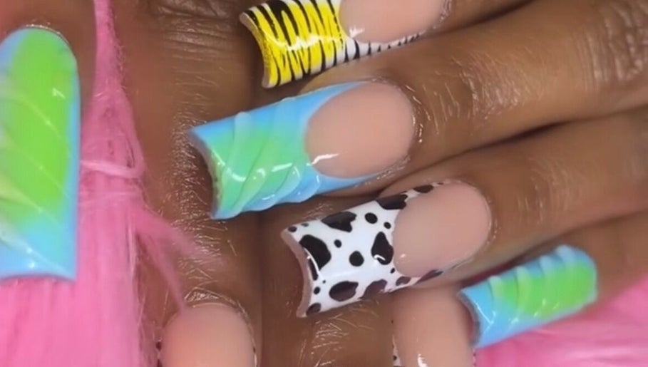 Colorful nail designs at Nailsbydarri, Shaker Heights, Ohio, US. Unique patterns and vibrant colors featured.