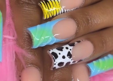 Colorful nail designs at Nailsbydarri, Shaker Heights, Ohio, US. Unique patterns and vibrant colors featured.