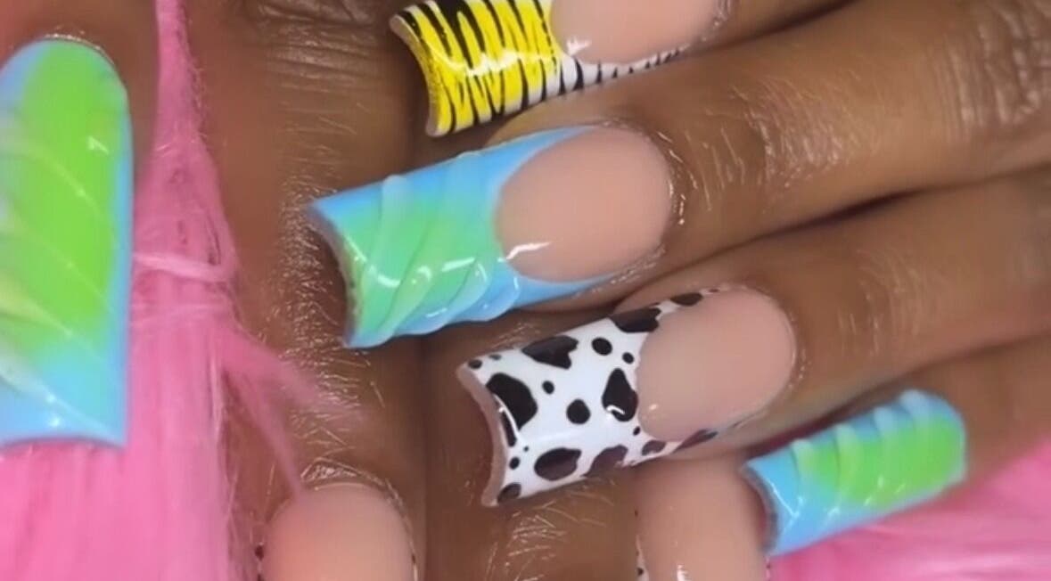 Colorful nail designs at Nailsbydarri, Shaker Heights, Ohio, US. Unique patterns and vibrant colors featured.