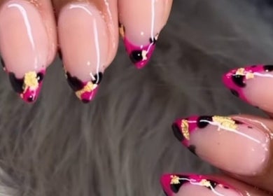 Elegant manicured nails with pink and gold design at Nailsbydarri, Shaker Heights, Ohio, US.