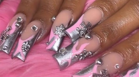 Elegant nail art with silver and pink designs at Nailsbydarri, Shaker Heights, Ohio, US.