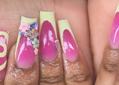 Pink acrylic nails with floral and gem accents at Nailsbydarri, Shaker Heights, Ohio, US.