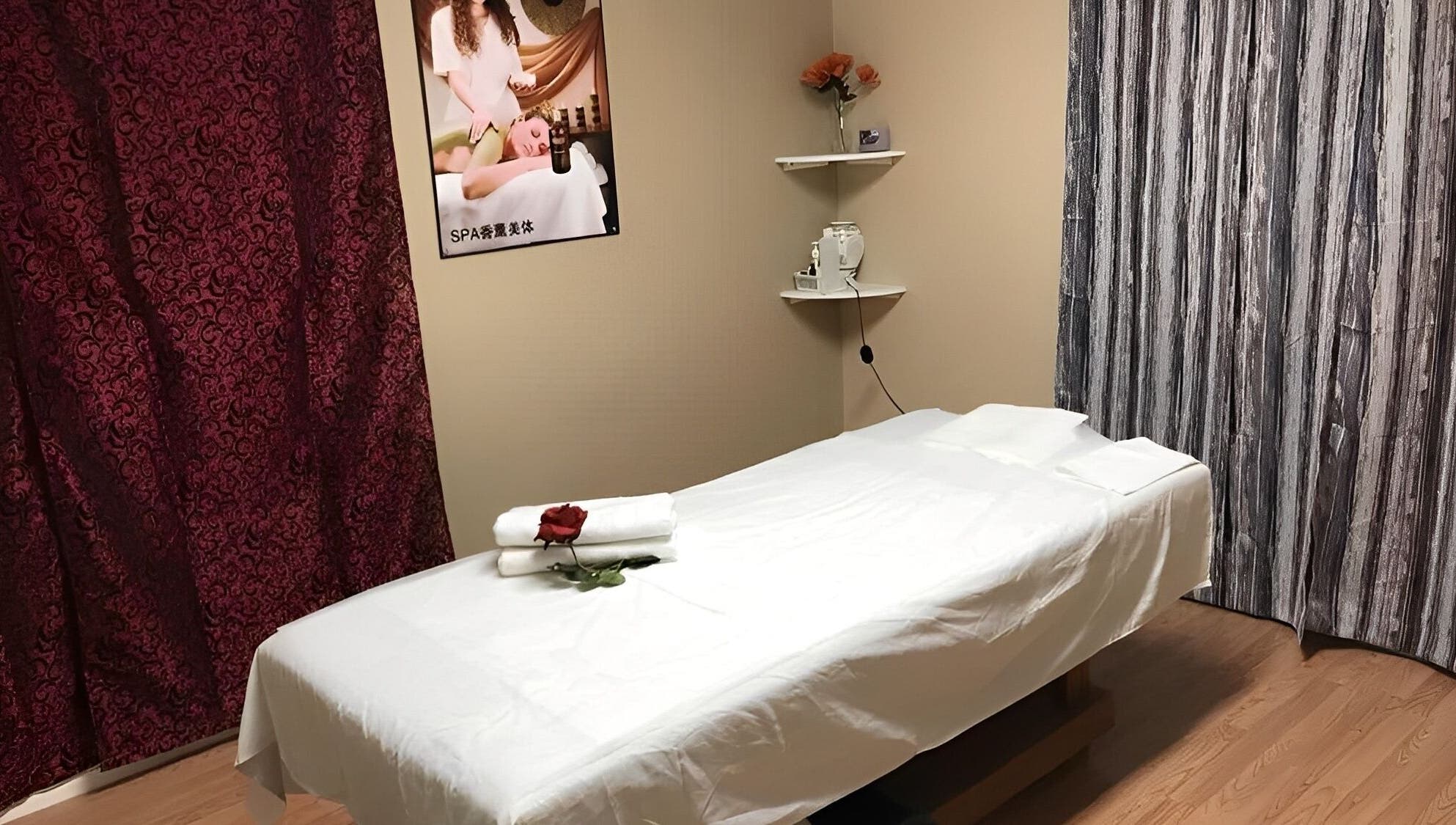 Tranquil massage room at Rainbow Spa, Riverside, California, US, featuring a massage table and calming decor.