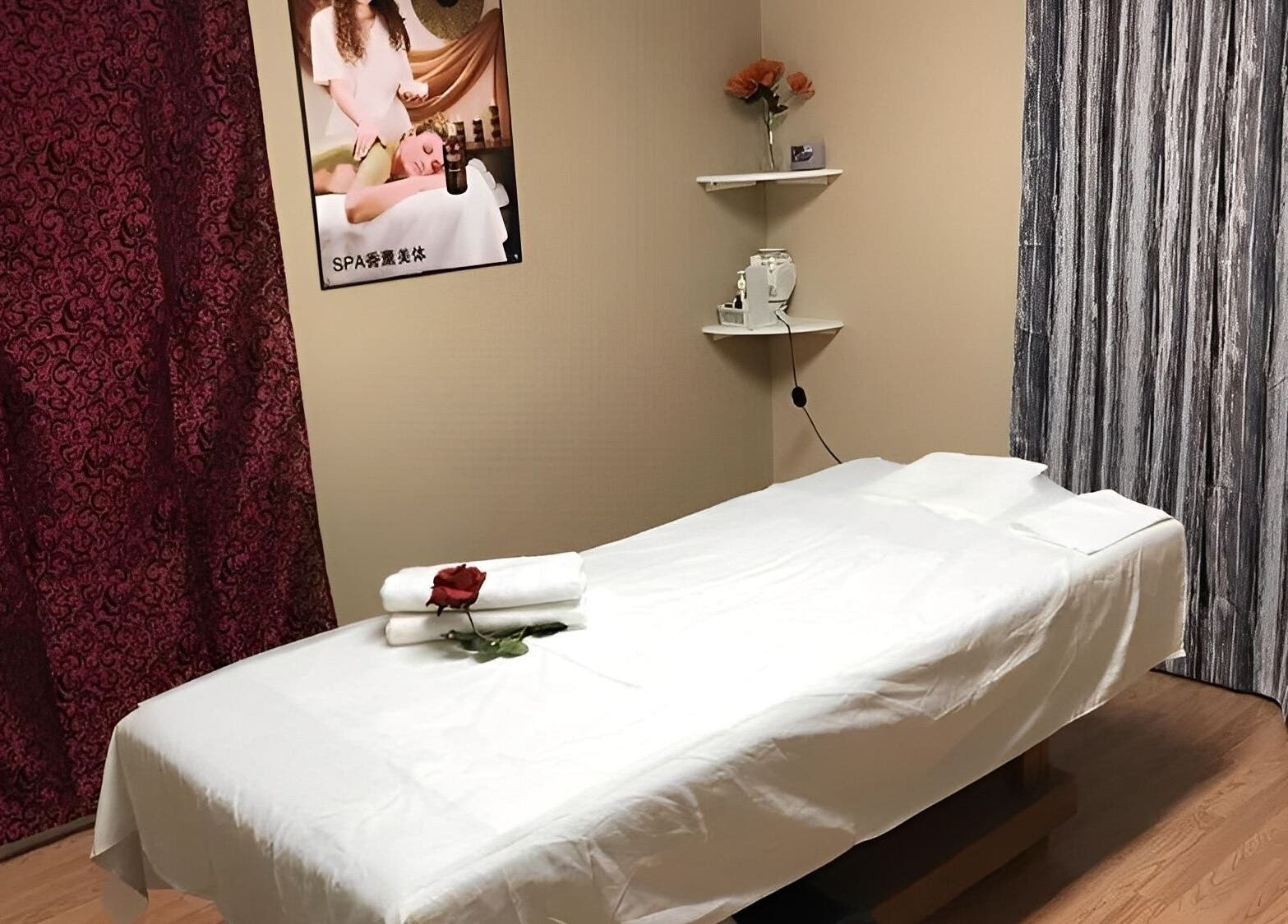Tranquil massage room at Rainbow Spa, Riverside, California, US, featuring a massage table and calming decor.