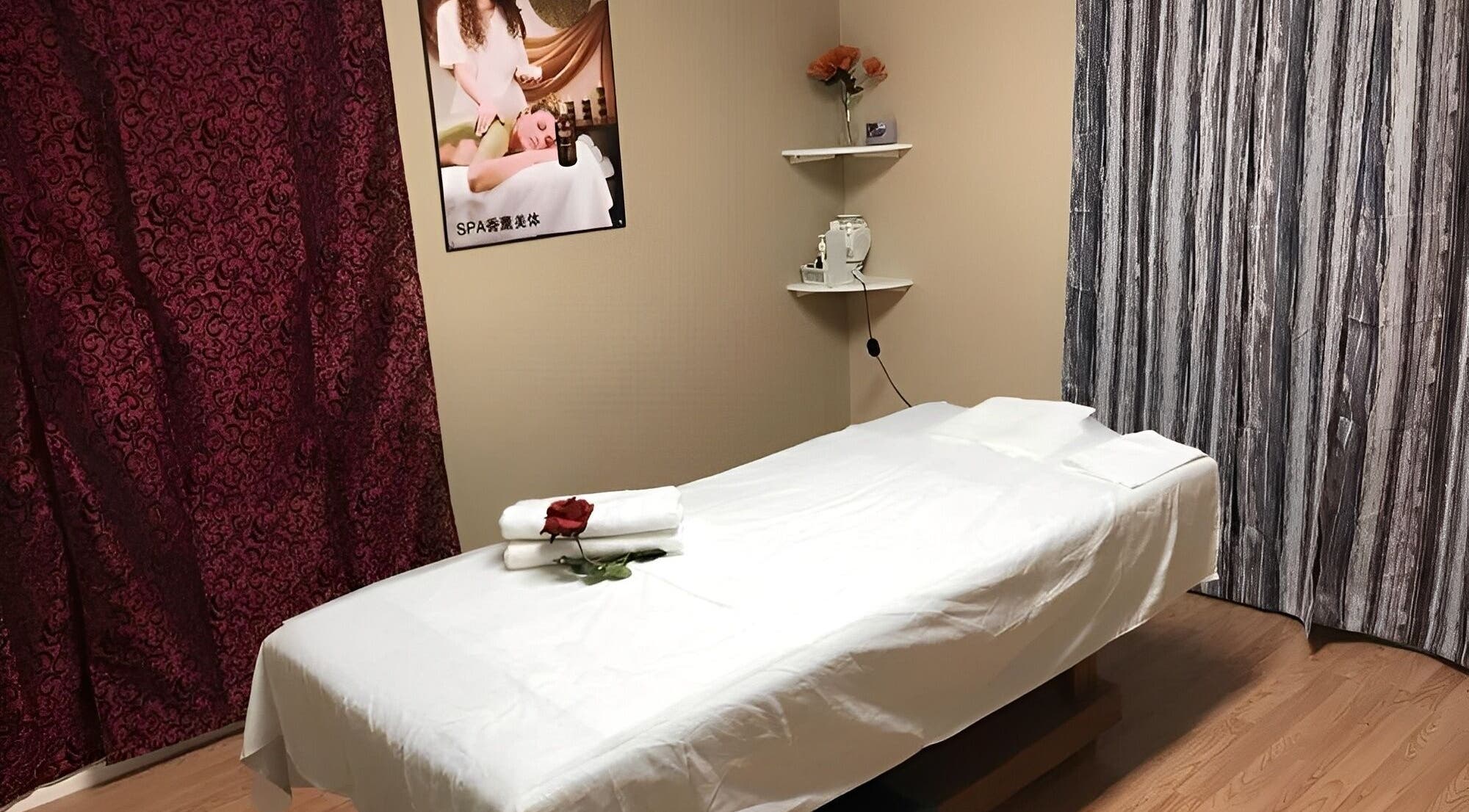 Tranquil massage room at Rainbow Spa, Riverside, California, US, featuring a massage table and calming decor.