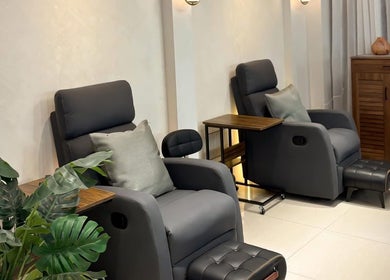 Relaxing lounge with plush chairs at Make Up by Kai, Davao City, Davao Region, PH, offering tranquil ambiance.