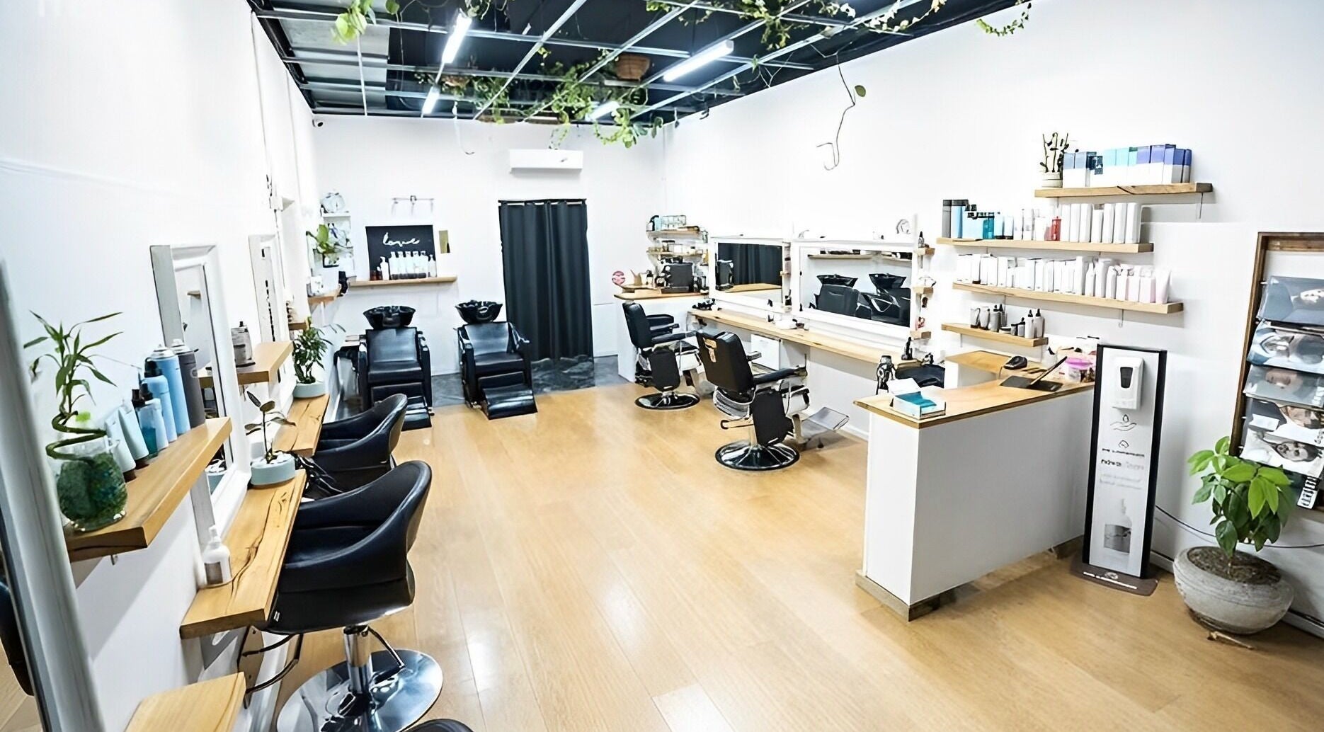Inside Breathe Hair & Wellbeing Frankston, a chic salon in Melbourne, Victoria, AU featuring modern workstations.