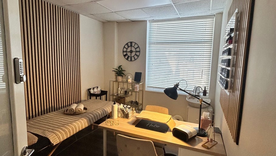 Relaxing treatment room at Glow up with Claire, Bingley, England, GB, featuring a comfortable therapy bed and soft lighting.