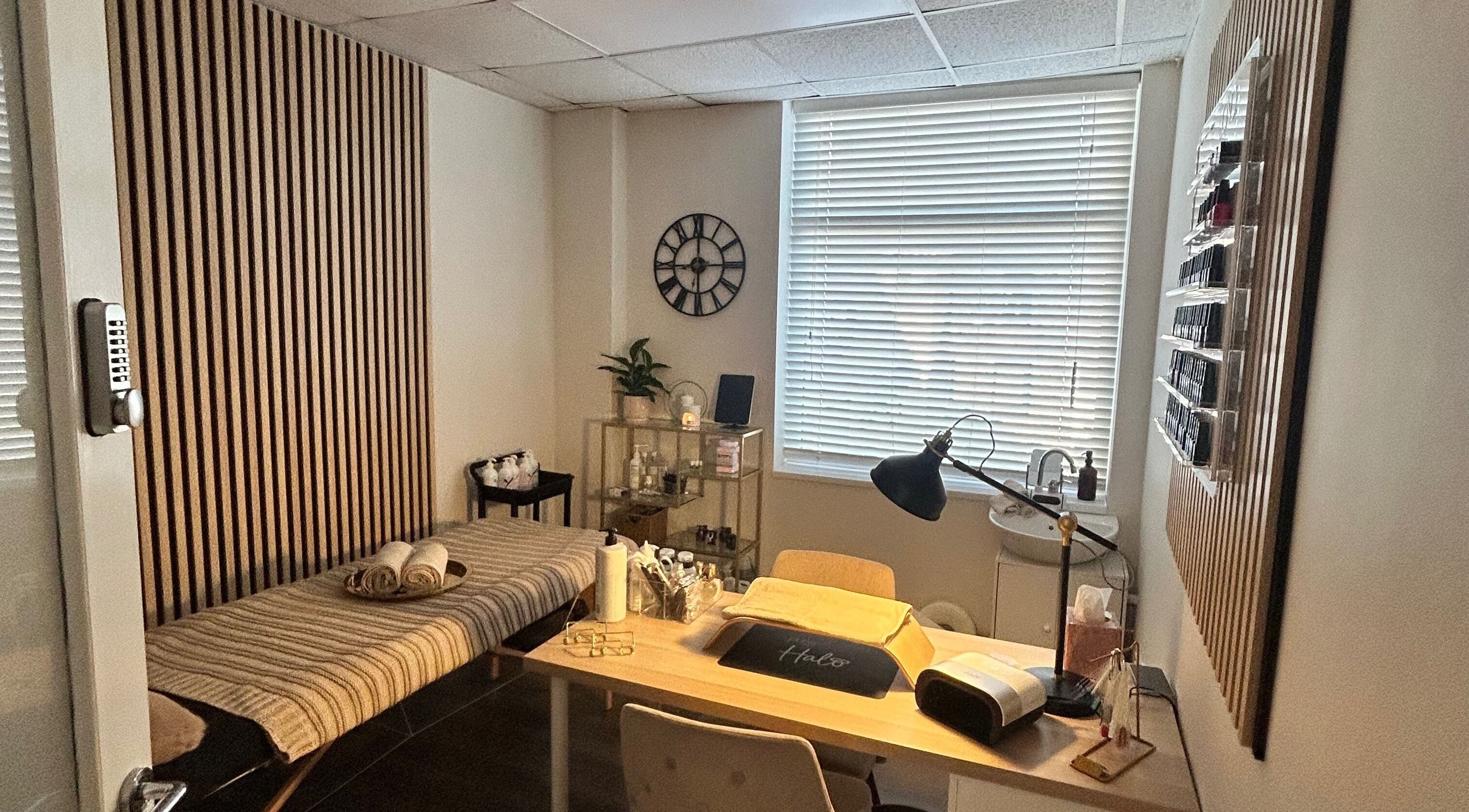 Relaxing treatment room at Glow up with Claire, Bingley, England, GB, featuring a comfortable therapy bed and soft lighting.