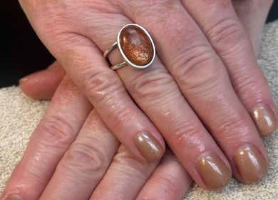 Shimmering golden nails with ring at Glow up with Claire, Bingley, England, GB.
