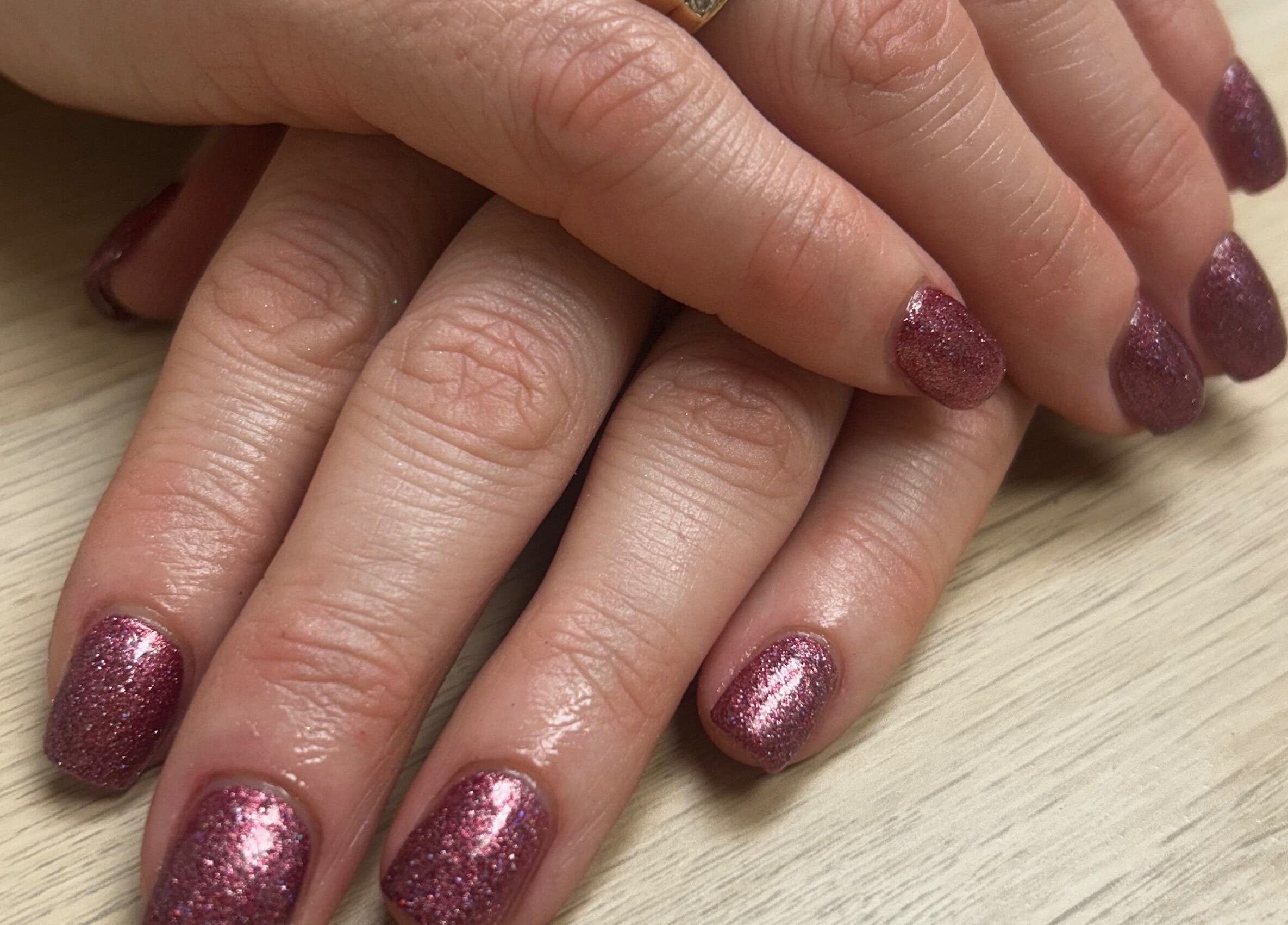 Sparkling pink nails designed at Glow up with Claire in Bingley, England, GB, showcasing expert manicure skills.