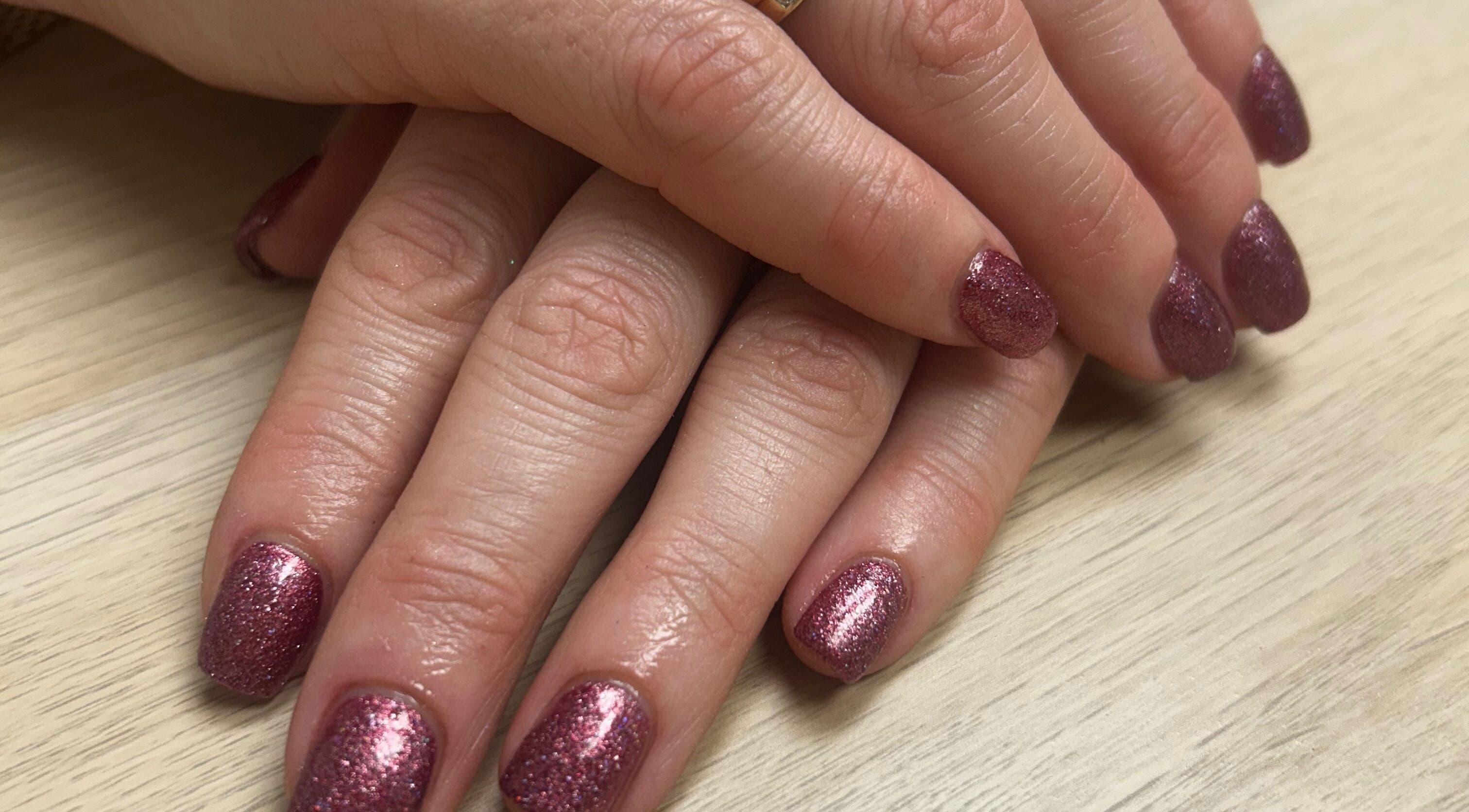 Sparkling pink nails designed at Glow up with Claire in Bingley, England, GB, showcasing expert manicure skills.