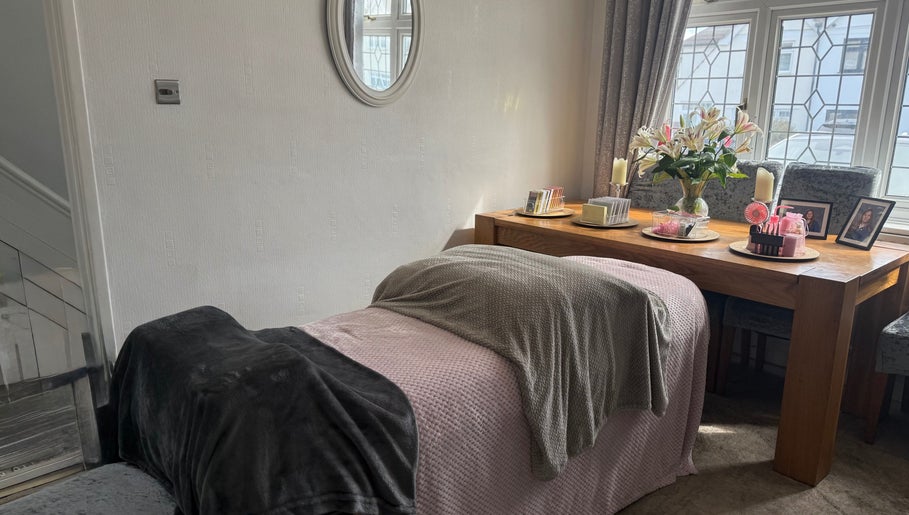 Relaxing beauty treatment room at Eye Candy, London, England, GB featuring a bed and decorative elements.
