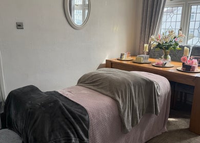 Relaxing beauty treatment room at Eye Candy, London, England, GB featuring a bed and decorative elements.