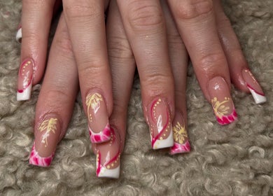 Elegant floral nail art at Nails by Kula, Liskeard, England, GB. Stunning design with pink and yellow motifs.