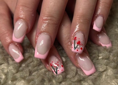 Elegant pink French manicure with floral design at Nails by Kula, Liskeard, England, GB.
