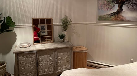 Elegant therapy room at Leah Hébert Massothérapie, Beauharnois, Québec, CA. Features a serene, decorated dresser.