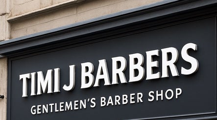 Signage of TIMIJBARBERS in Paisley, Scotland, GB, highlighting gentlemen's barber shop.