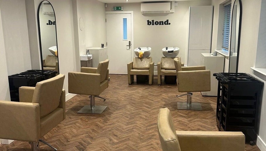 Elegant salon interior at Kayleigh Spencer Hair in Southampton, England, GB with modern styling chairs and mirrors.