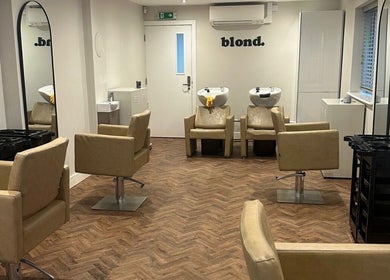 Elegant salon interior at Kayleigh Spencer Hair in Southampton, England, GB with modern styling chairs and mirrors.
