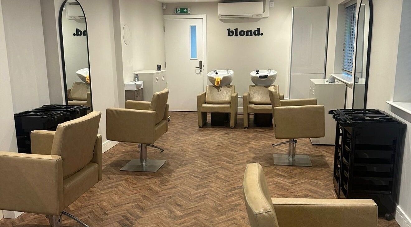 Elegant salon interior at Kayleigh Spencer Hair in Southampton, England, GB with modern styling chairs and mirrors.