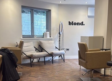 Elegant interior of Kayleigh Spencer Hair in Southampton, England, GB, featuring plush chairs and modern decor.
