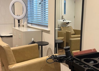 Modern salon interior at Kayleigh Spencer Hair in Southampton, England, GB, featuring stylish seating and equipment.