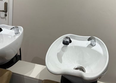 Modern wash stations at Kayleigh Spencer Hair in Southampton, England, GB, offering luxury hair care.