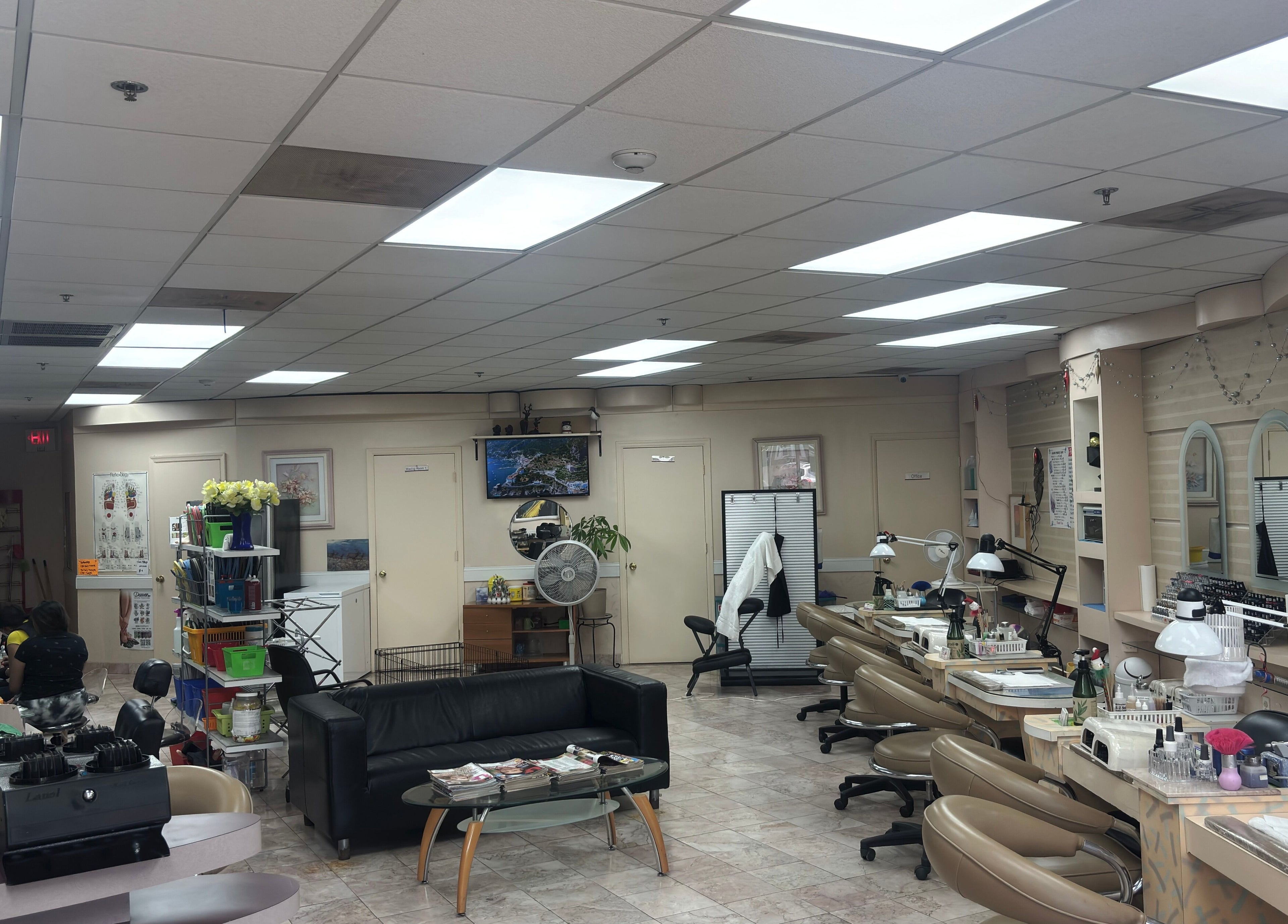 Bright, welcoming interior of Harrison Nails NJ in Harrison, New Jersey, with manicure stations and comfortable seating.
