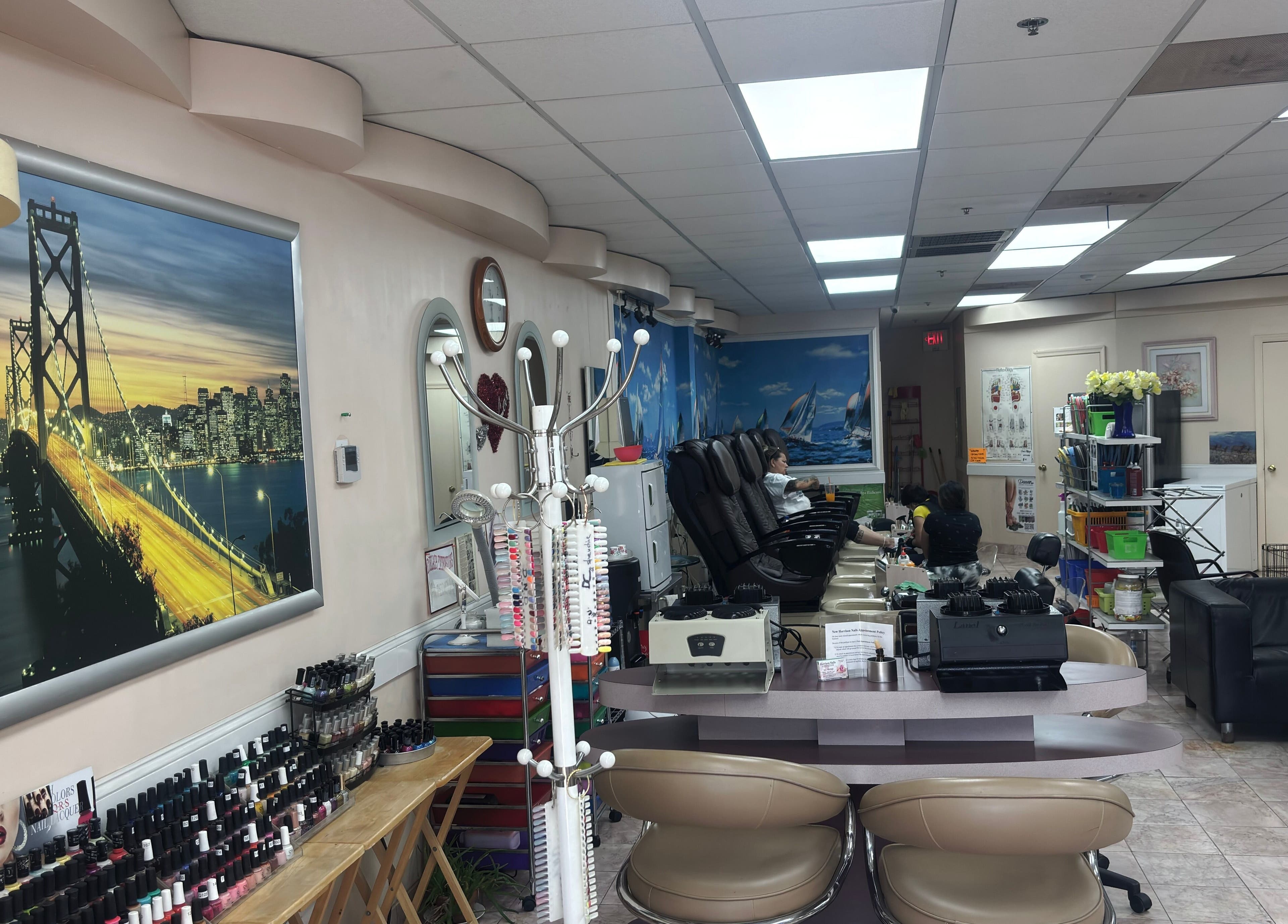 Interior of Harrison Nails NJ in Harrison, New Jersey, US, showcasing manicure stations and decor.
