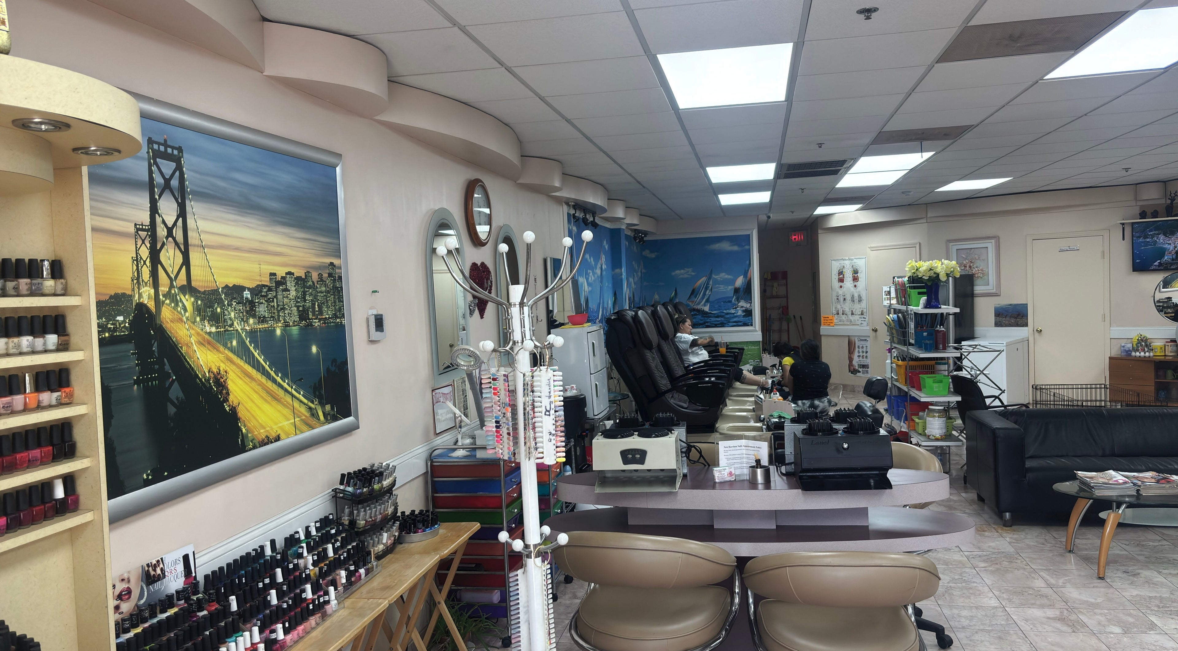 Interior of Harrison Nails NJ in Harrison, New Jersey, US, showcasing manicure stations and decor.