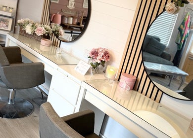 Elegant vanity area at Pretty Hair Cabin, Stockton-on-Tees, England, GB with plush chairs and floral decor.