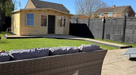 Pretty hair cabin in lush garden at Stockton-on-Tees, England, GB, perfect for relaxation and beauty treatments.