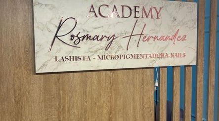 Sign of Academy Rosmary Hernandez showcasing services like lashista and nails in Kralendijk, Bonaire, BQ.