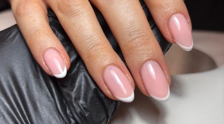 Stylish French manicure at Kayas Beauty Room, Stevenage, England, GB showcasing elegant pink and white nails.