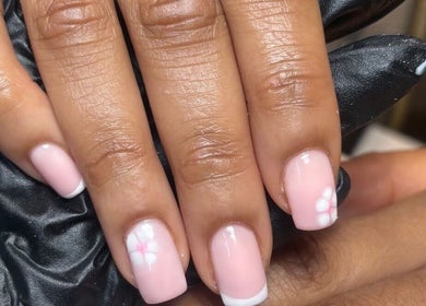 Delicate pink nail art at Kayas Beauty Room, Stevenage, England, GB. Manicured nails with floral accents.