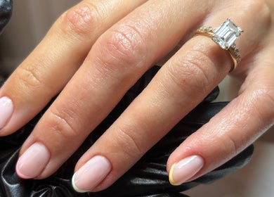 Close-up of hand with elegant French manicure at Kayas Beauty Room, Stevenage, England, GB.