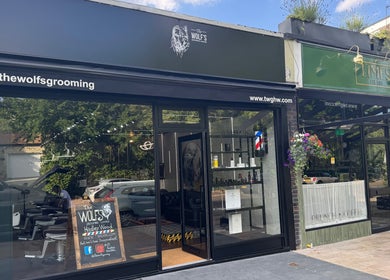 Exterior of The Wolfs Grooming Lounge Hadley Wood in Barnet, England, GB showcasing modern design.