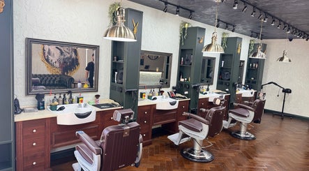 Stylish grooming chairs at The Wolfs Grooming Lounge Hadley Wood, Barnet, England, GB, embodying luxury and elegance.