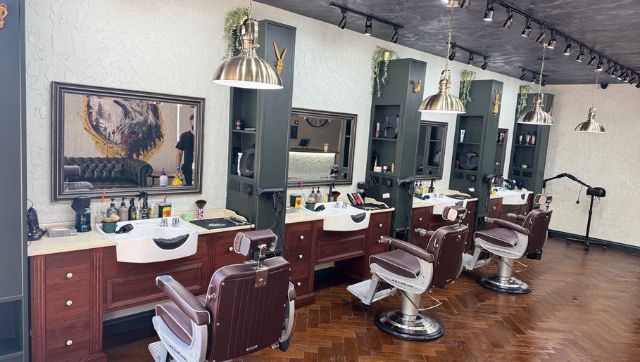 Luxurious barber chairs at The Wolfs Grooming Lounge Hadley Wood in Barnet, England, GB, showcasing elegance and style.