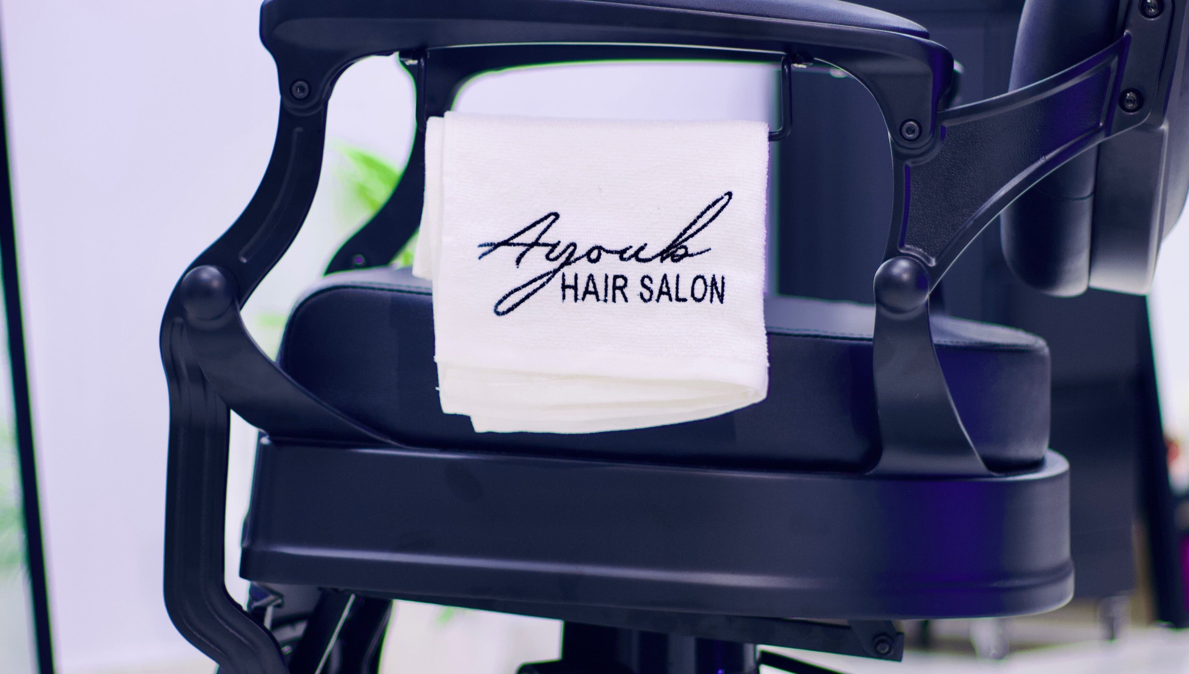 Stylish chair at Ayoub Hair Salon with a towel in Tétouan, Tanger-tétouan-al Hoceima, MA.