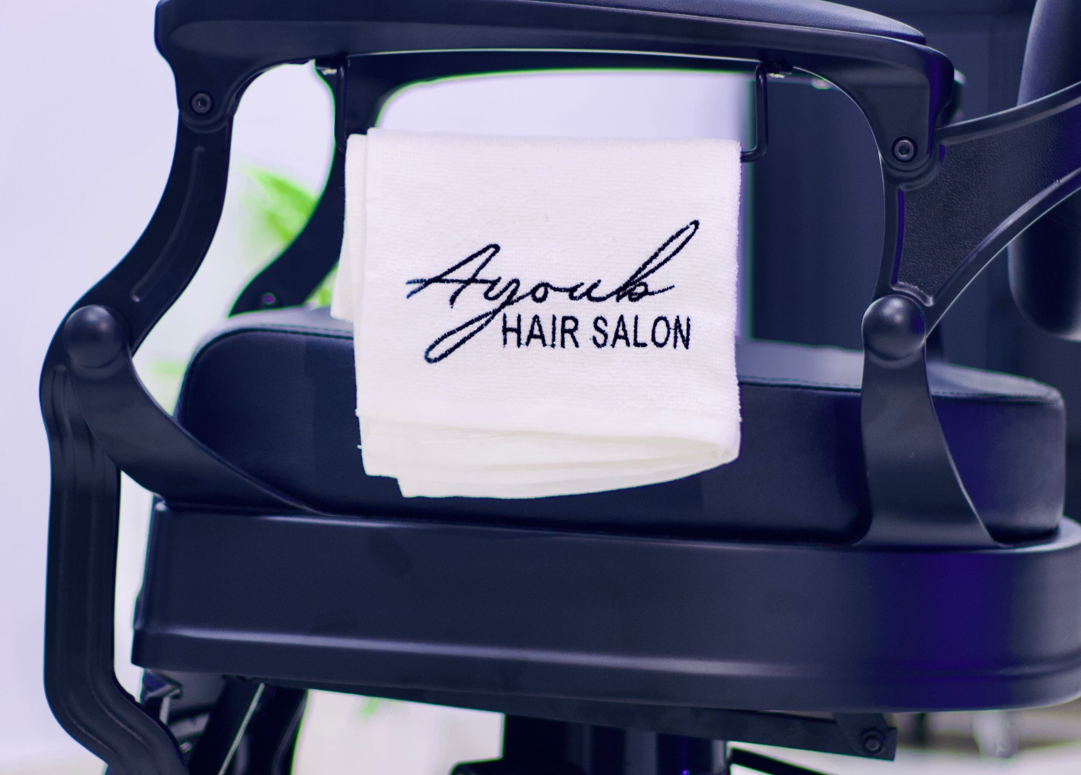 Stylish chair at Ayoub Hair Salon with a towel in Tétouan, Tanger-tétouan-al Hoceima, MA.