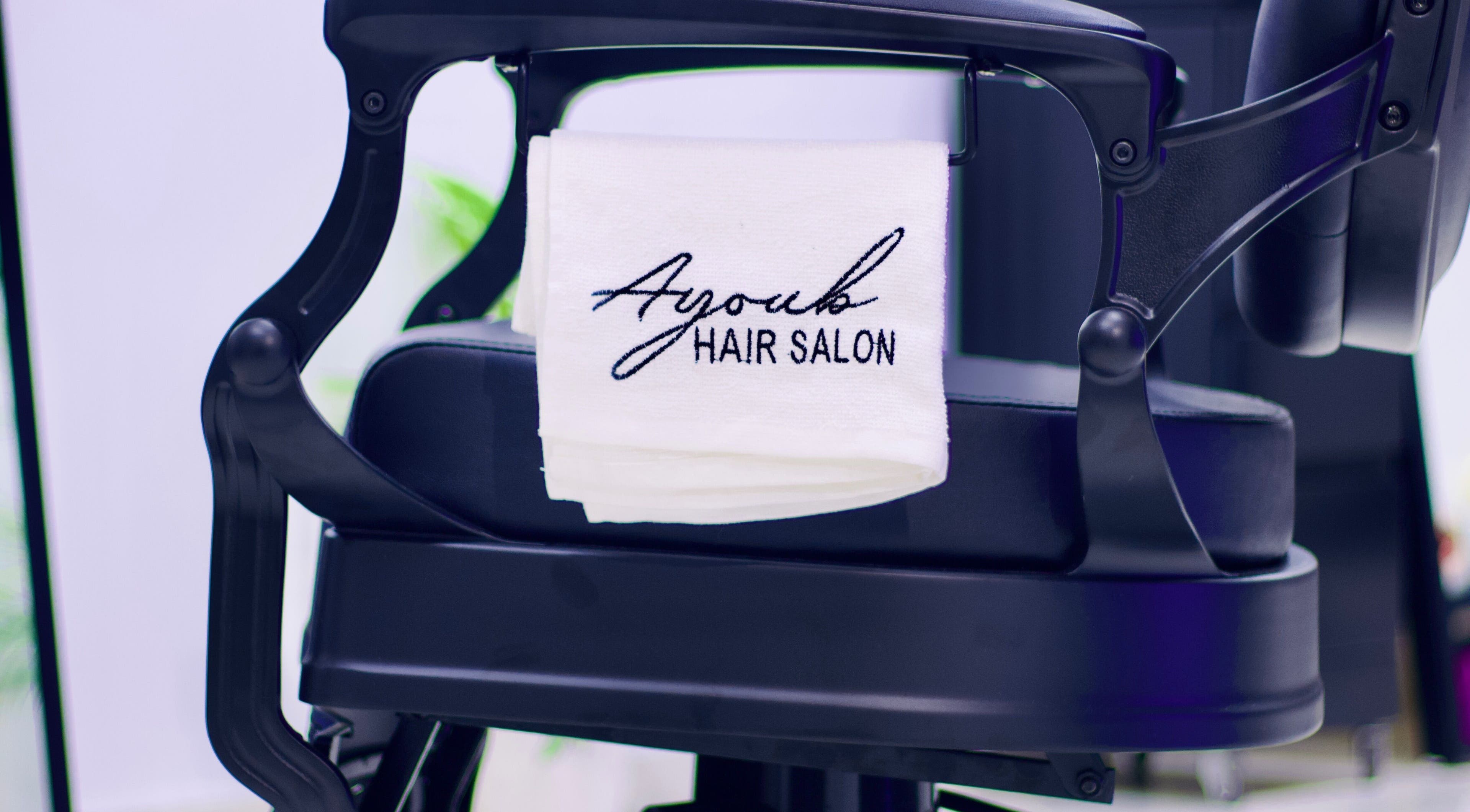 Stylish chair at Ayoub Hair Salon with a towel in Tétouan, Tanger-tétouan-al Hoceima, MA.