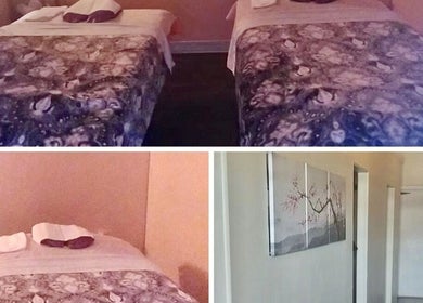 Relaxing massage room at Foot Massage in Austin, Texas, US with two cozy beds and calming decor.