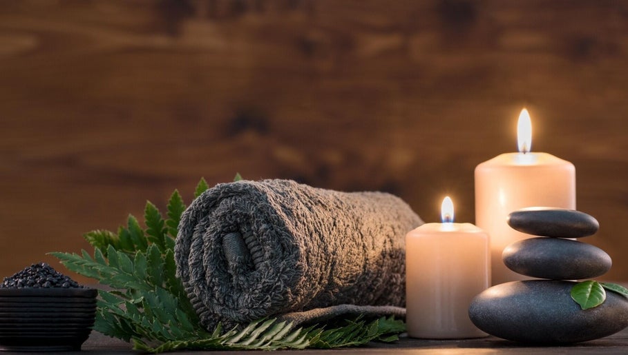 Foot Massage in Austin, Texas, US offers a serene retreat with candles, stones, and lush greenery.