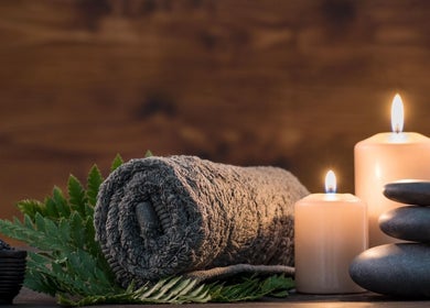 Foot Massage in Austin, Texas, US offers a serene retreat with candles, stones, and lush greenery.