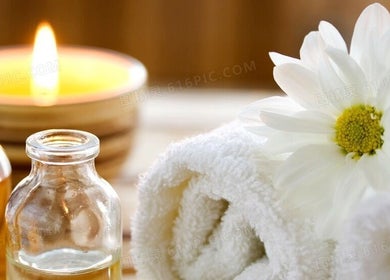 Relaxing Foot Massage setting in Austin, Texas, US featuring candle, oils, and flower.